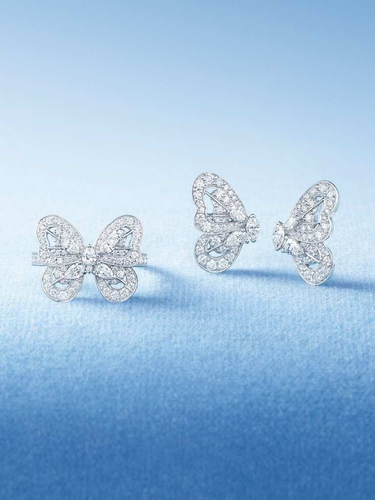 Classics Jewellery Collection white gold Necklace and Earrings with yellow diamond on blue background