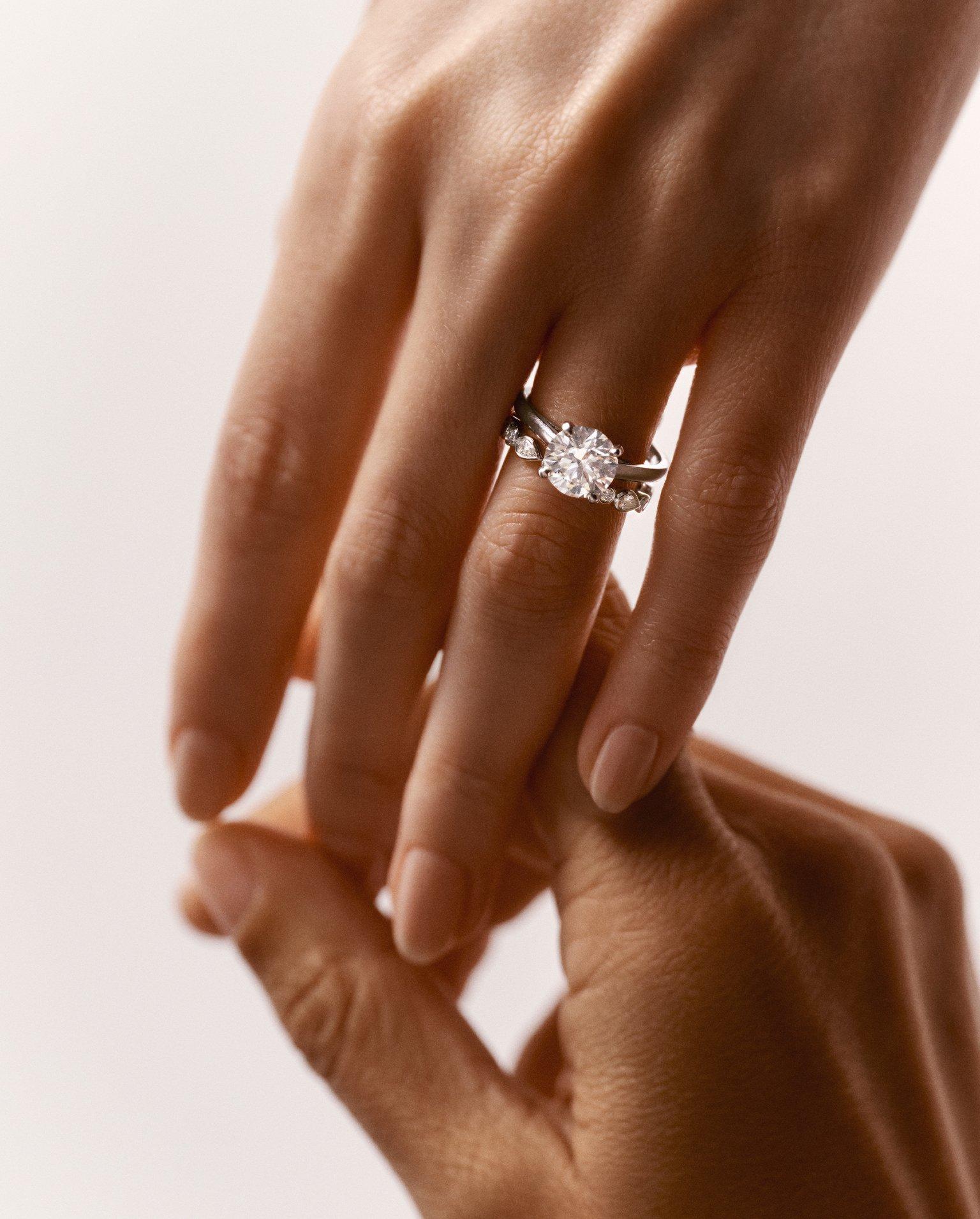 Lotus on model wearing Lotus by DE BEERS jewellery collection