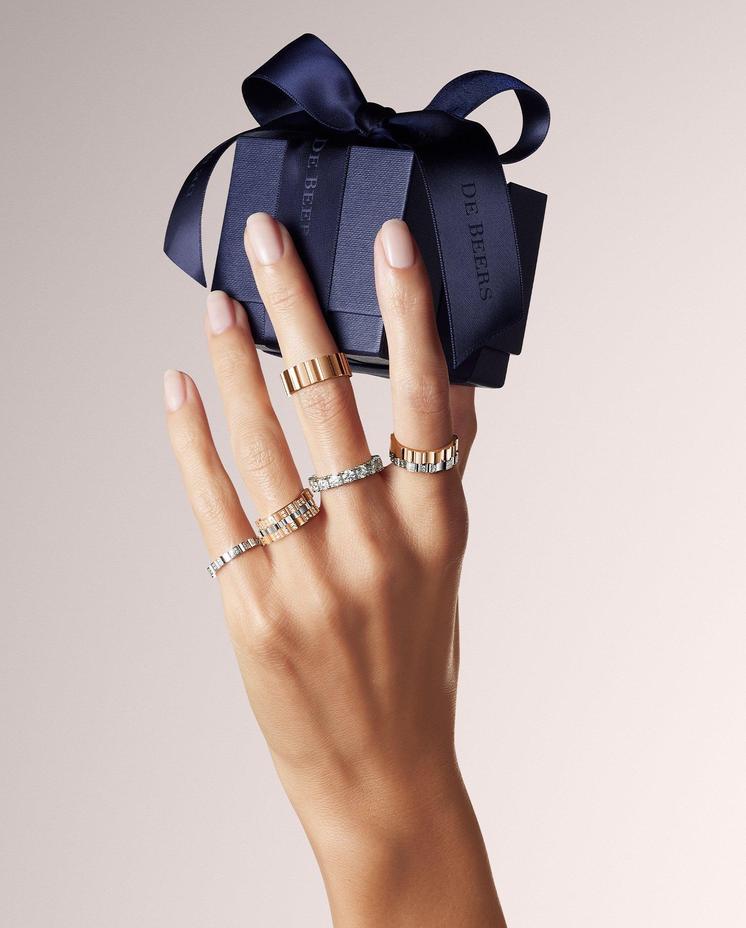 Lotus on model wearing Lotus by DE BEERS jewellery collection