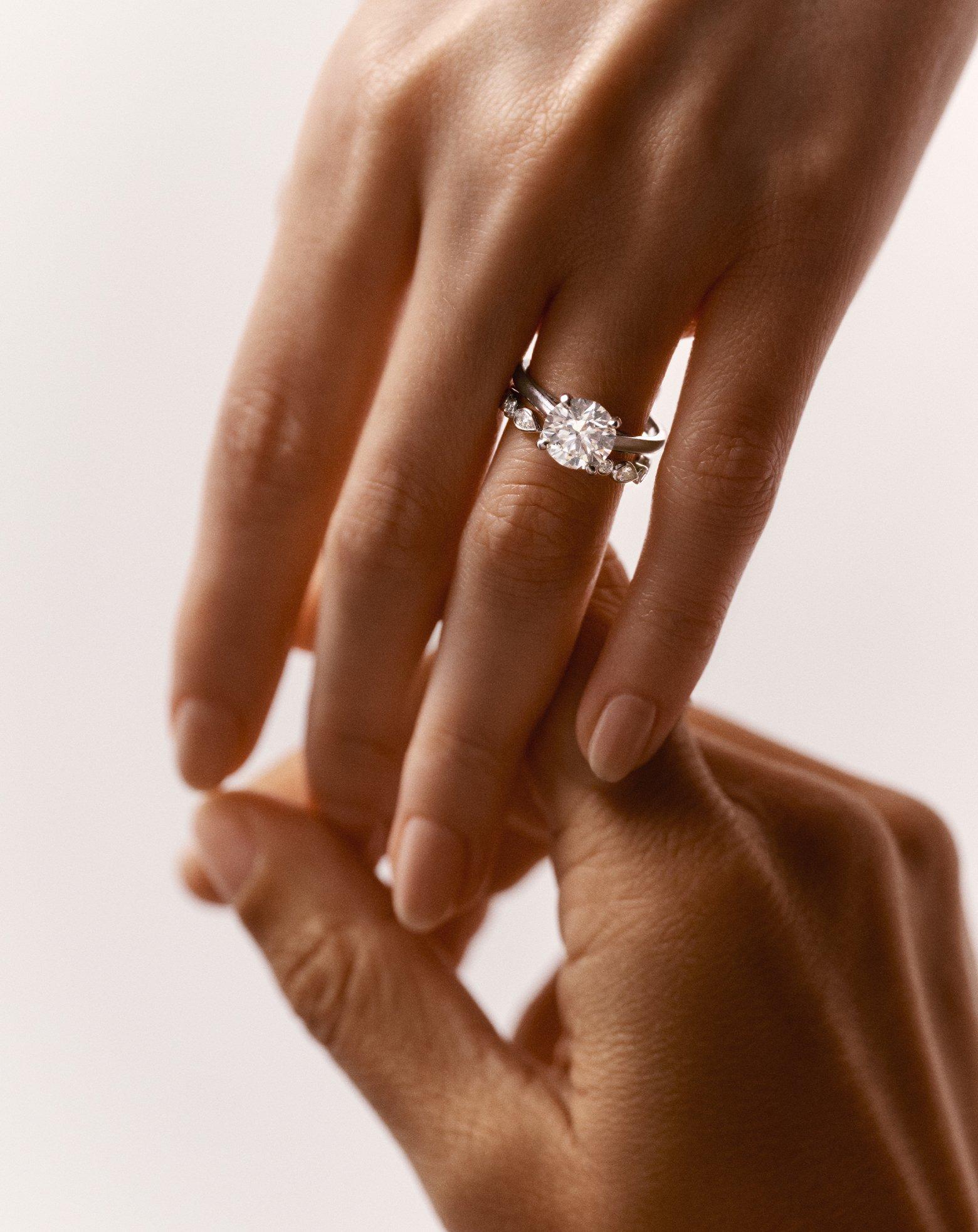Lotus on model wearing Lotus by DE BEERS jewellery collection