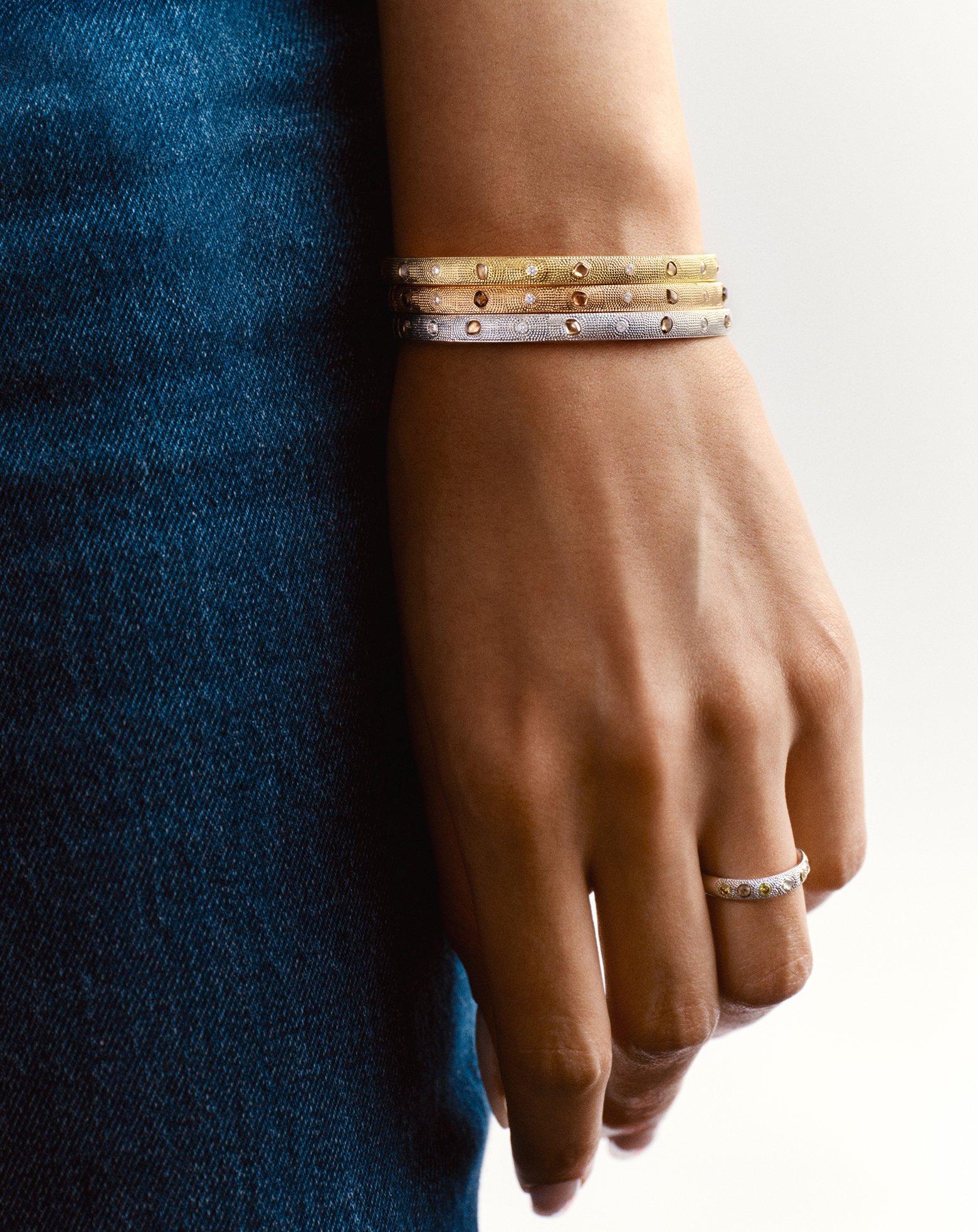 Lotus on model wearing Lotus by DE BEERS jewellery collection
